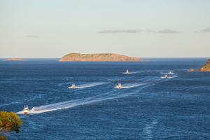 Part of the fleet returning home as the sun sets low and casts a glorious hue over Boondelbah Island. - 2016 NSWGFA Interclub Championship photo copyright  John Curnow taken at  and featuring the  class
