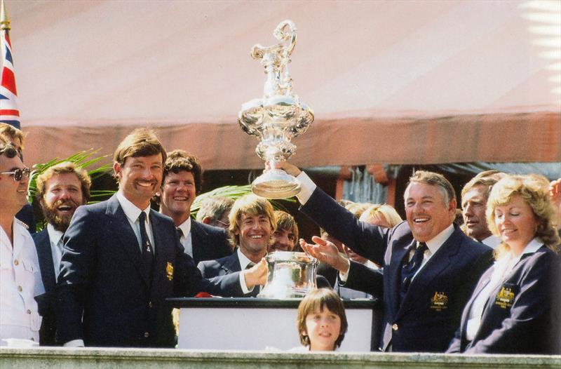 John Bertrand, helmsman of Australia II (left) whole syndicate head, Alan Bond holds the America's Cup aloft for all spectators and press members to see, from the lawn of the Vanderbilt's Marble House photo copyright Paul A. Darling taken at New York Yacht Club and featuring the 12m class