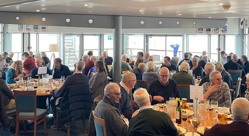 Unlike the honed, athletic racing snake crews of today, the FiveO fleet have always enjoyed their ‘grub' and with the catering team at Hayling serving up an excellent meal they were soon all tucking in photo copyright Sue Tulloch taken at Hayling Island Sailing Club and featuring the 505 class