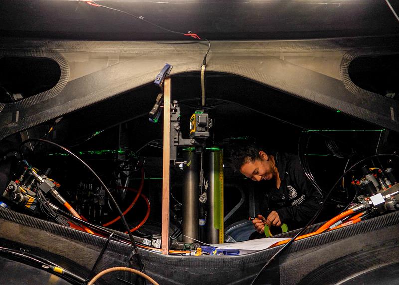 Kelly Hartzell of ETNZ's Mechatronincs Team works inside the AC40 hull prior to stress testing  - September 2022 - photo © Emirates Team NZ