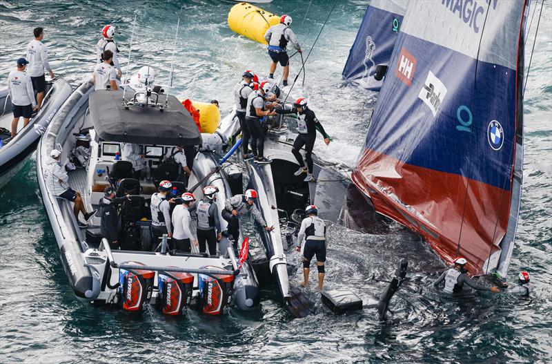 The America's Cup support teams work together to save NYYC American Magic's Patriot after a huge capsize on day 3 of the PRADA Cup - photo © COR36 / Studio Borlenghi