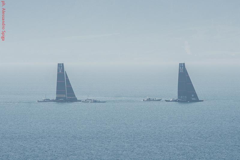 INEOS Team UK head out as Luna Rossa comes back into port and begins dropping her jib - Cagliari, Sardinia - January 20120 - photo © Alessandro Spiga