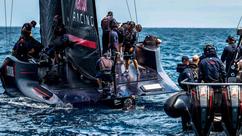 Diver climbs back onto Alinghi Red Bull Racing - AC75 - Day 20 - May 23, 2024 - Barcelona - photo © Alex Carabi / America's Cup