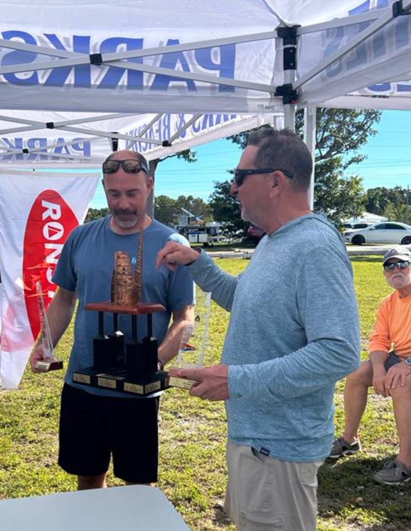 Mahoney and Webbon receiving Perpetual Trophy at the 2023 A-Class Midwinters photo copyright Flor Issel taken at Upper Keys Sailing Club and featuring the A Class Catamaran class