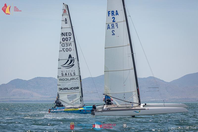A Class Catamaran Europeans Day 2 - Emmanuel Do´de  (conventional rig) and Mischa Heemskerk (experimental 'DN' Ice-yacht inspired extreme bendy rig) - photo © Gordon Upton / www.guppypix.com