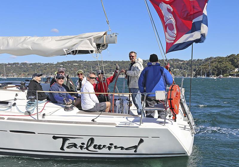 The enthusiastic crew of Tailwind, and that massive Beneteau backstay flag… - photo © John Curnow