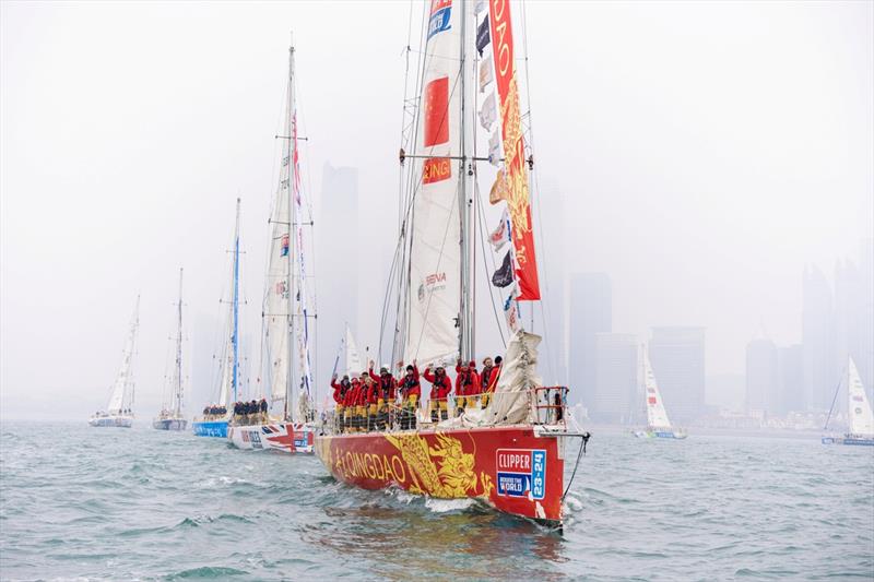Qingdao leads the Parade of Sail out of the Olympic Sailing Centre Marina photo copyright Clipper Race taken at  and featuring the Clipper 70 class