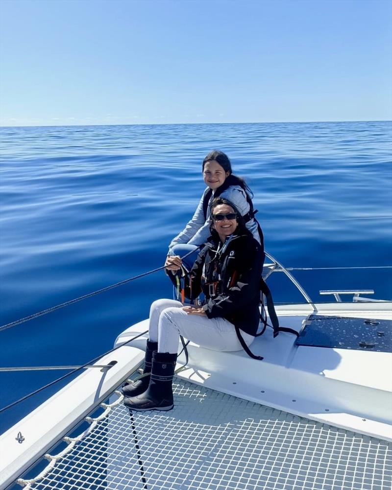 Kim and daughter Sophia,watching dolphins, counting sharks & crabs during 220 nautical miles, crossing of the Bay of Biscay, France - photo © Kim Lawler
