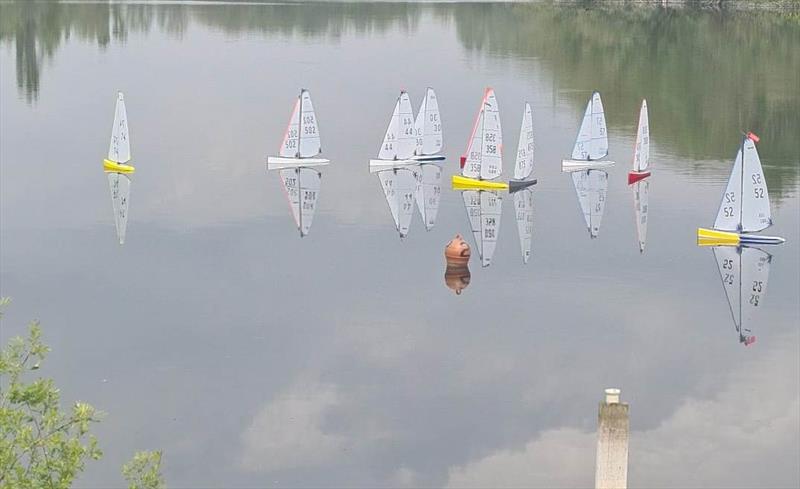 DF95 ASH Trophy & M&S District Championship: A mirror calm and yet these boats are able to sail and complete 7 races photo copyright Mike Wilkie taken at Guildford Model Yacht Club and featuring the DF95 class