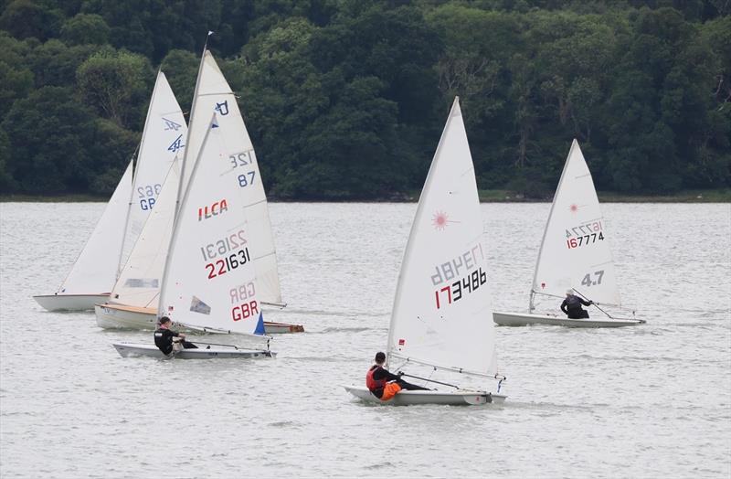Finn Harris 221631 and Toby Iglehart 173486 in close racing with a couple of the bigger boats and a 4.7 - club racing at Solway photo copyright Margaret Purkis taken at Solway Yacht Club and featuring the Dinghy class