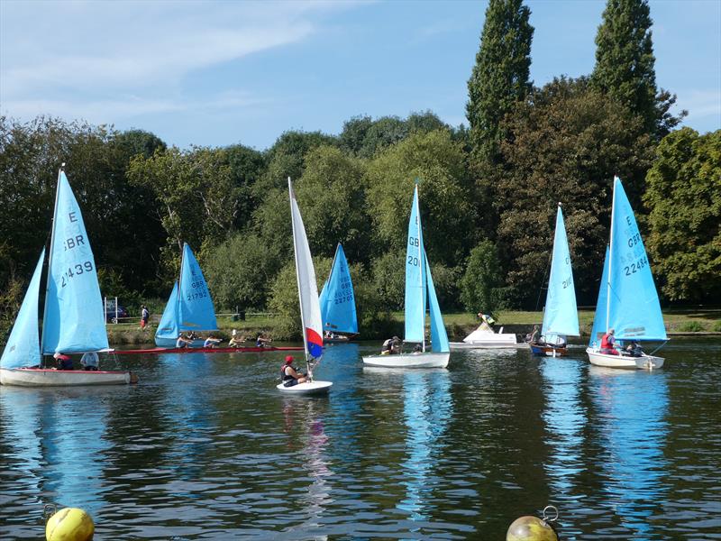 Busy River: A rowing four and coach boat cruise through the start line on Sunday at the Minima Regatta 2023 photo copyright Rob Mayley taken at Minima Yacht Club and featuring the Enterprise class