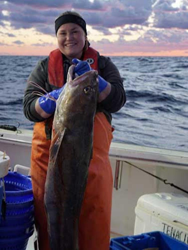 Cooperative Research Branch field biologist, Emma Fowler, holds one of the more impressively sized white hake during the Fall 2021 survey photo copyright NOAA Fisheries / Giovanni Gianesin taken at  and featuring the Environment class