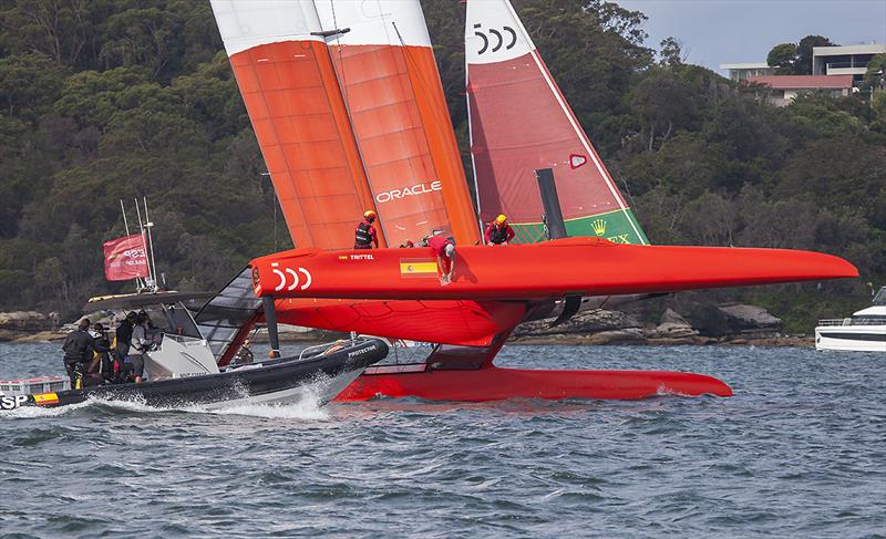 Repairs (a giant sticker if you like) get applied to Team ESP after their collision with Team FRA on Day One photo copyright John Curnow taken at Royal Sydney Yacht Squadron and featuring the F50 class