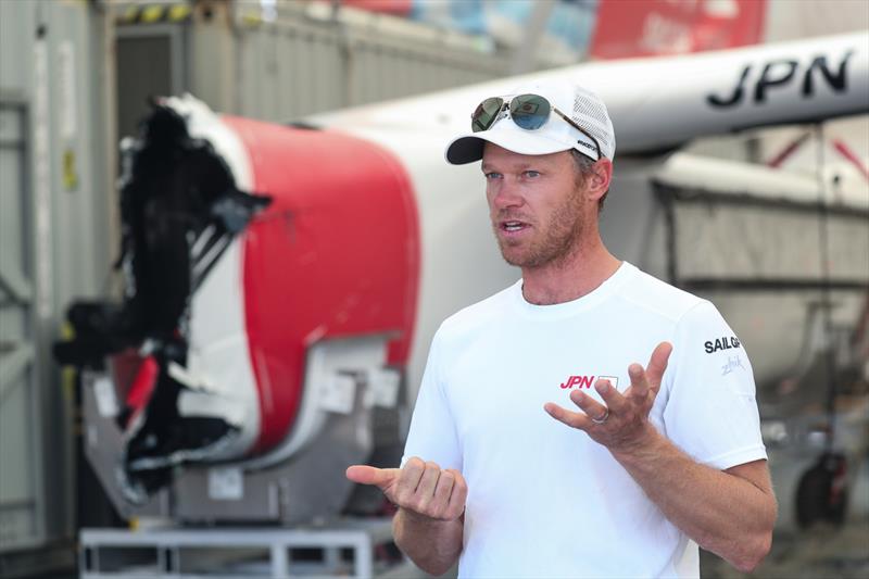 Nathan Outteridge, CEO & driver of Japan SailGP Team, stands next to the F50 catamaran that sustained damage in a collision with Great Britain SailGP Team during previous days racing photo copyright Brett Costello/SailGP taken at Woollahra Sailing Club and featuring the F50 class