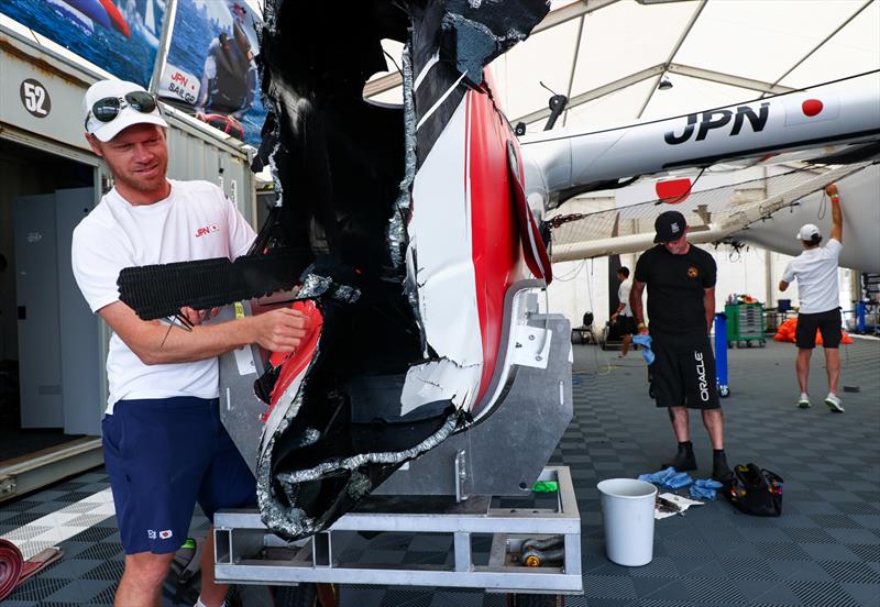 Nathan Outteridge, CEO & driver of Japan SailGP Team, looks at the damage to the F50 catamaran caused by a collision with Great Britain SailGP Team, on Race Day 2. Australia Sail Grand Prix - photo © Patrick Hamilton/SailGP