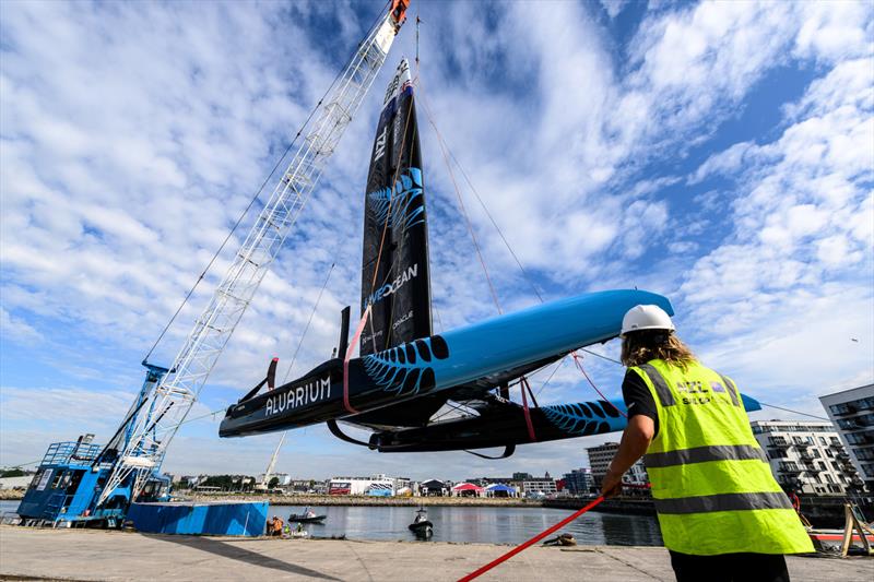 New Zealand SailGP Team F50 catamaran being craned into the water at the Technical Base prior to a practice session ahead of the Great Britain Sail Grand Prix | Plymouth in Plymouth, England. 29th July, 2022 photo copyright Ricardo Pinto/SailGP taken at Royal Plymouth Corinthian Yacht Club and featuring the F50 class