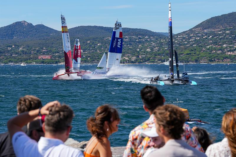 Spain SailGP Team, Canada SailGP Team, France SailGP Team and New Zealand SailGP Team in action as spectators watch on from the Fan Village on Race Day 1 of the Range Rover France Sail Grand Prix in Saint Tropez, France photo copyright Andrew Baker/SailGP taken at Société Nautique de Saint-Tropez and featuring the F50 class