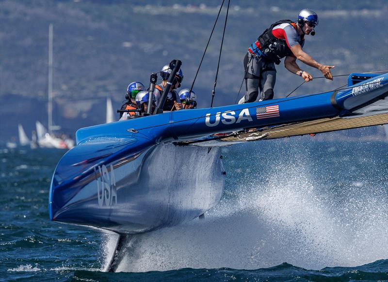 Cooper Dressler, grinder of USA SailGP Team, crosses the boat during a manoeuvre on Race Day 1 of the KPMG Australia Sail Grand Prix in Sydney - photo © David Gray for SailGP