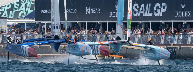 Great Britain SailGP Team helmed by Ben Ainslie and France SailGP Team helmed by Quentin Delapierre sail past the Adrenaline Lounge on Race Day 2 of the Dubai Sail Grand Prix presented by P&O Marinas in Dubai, United Arab Emirates photo copyright Ricardo Pinto for SailGP taken at  and featuring the F50 class