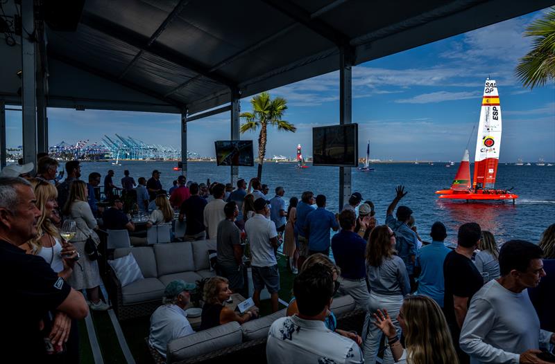 Spectators with from the Adrenaline Lounge as Spain SailGP Team sail past in action in the Race Stadium on Race Day 1 of the Oracle Los Angeles Sail Grand Prix at the Port of Los Angeles, in California, USA. July 23, 2023 - photo © Adam Warner/SailGP