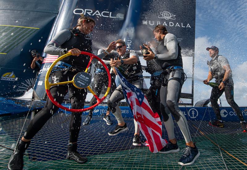 Peter Kinney, grinder of USA SailGP Team, sprays Barons De Rothschild Champagne on Erika Reineke, strategist of USA SailGP Team, as USA SailGP Team celebrate onboard after winning the Spain Sail Grand Prix in Cadiz, Spain - photo © Ricardo Pinto for SailGP