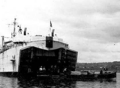 The Tank Landing Craft, moored in the entrance to the river Medina at Cowes, being loaded up with Fireflys destined for Torquay. It was now that the lack of launching trollies became apparent! - photo © Archive