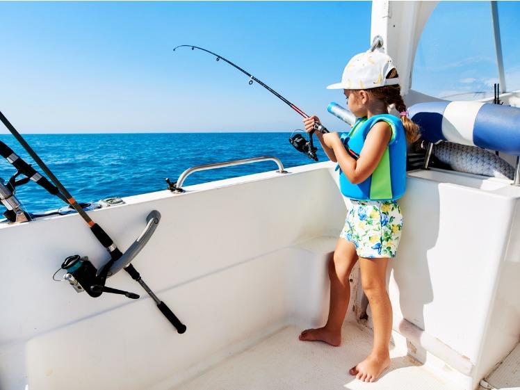 A beginner setting up a fishing rod and casting off a boat photo copyright Boat Accessories Australia taken at  and featuring the Fishing boat class