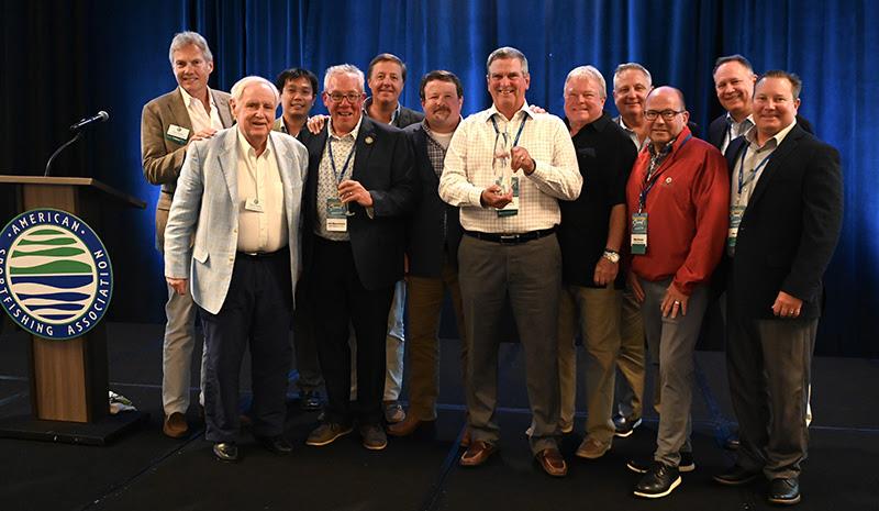 Kirk Immens, center, Sportco Marketing, Inc., received ASA's Lifetime Achievement award for his dedication to the association and the industry - photo © American Sportfishing Association