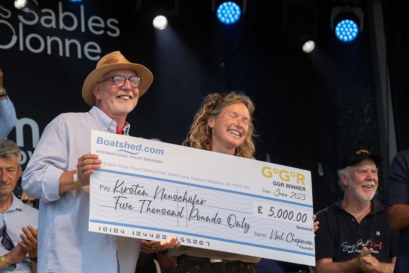 South African yachtswoman Kirsten Neuschäfer, winner of the 2022/3 Golden Globe Race, presented with her £5,000 winners cheque by Neil Chapman, CEO of Boatshed.com photo copyright Tim Bishop / GGR / PPL taken at  and featuring the Golden Globe Race class