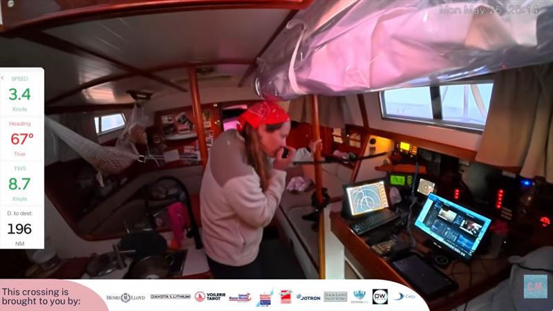 Mara has live-streamed 24/7 during her transatlantic adventures, but that required computers, iPads, iPhones and other equipment, all banned in GGR. Here, she tests her SSB HF radio while her chart table is temporarily taken over by live transmission gear - photo © Mara Kveseth
