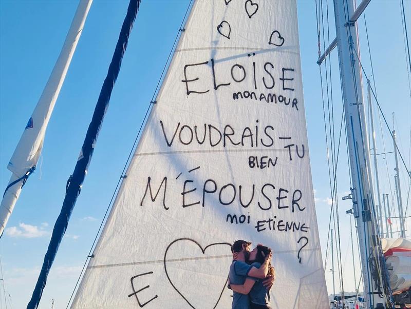 Qualifier completed, question asked—and answered. GGR 2026 entrant Etienne Messikommer celebrates the end of his mandatory 4,000-mile qualifying voyage with Éloïse beneath a marriage proposal written across the sail: ‘Éloïse, my love, will you marry me?'  - photo © Team Etienne Messikommer