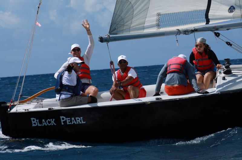 6th Annual USVI Hotel & Tourism Association Regatta - Team Pink Palm Hotel, L to R: Brent Pelton (far left, waving), STYC Coach Dennis Nixon (in front of Pelton), Jason Fleming, Louis Pierre Anderson-Morshead, Elisa James photo copyright STSC / C Bareuther taken at St. Thomas Sailing Center and featuring the IC24 class