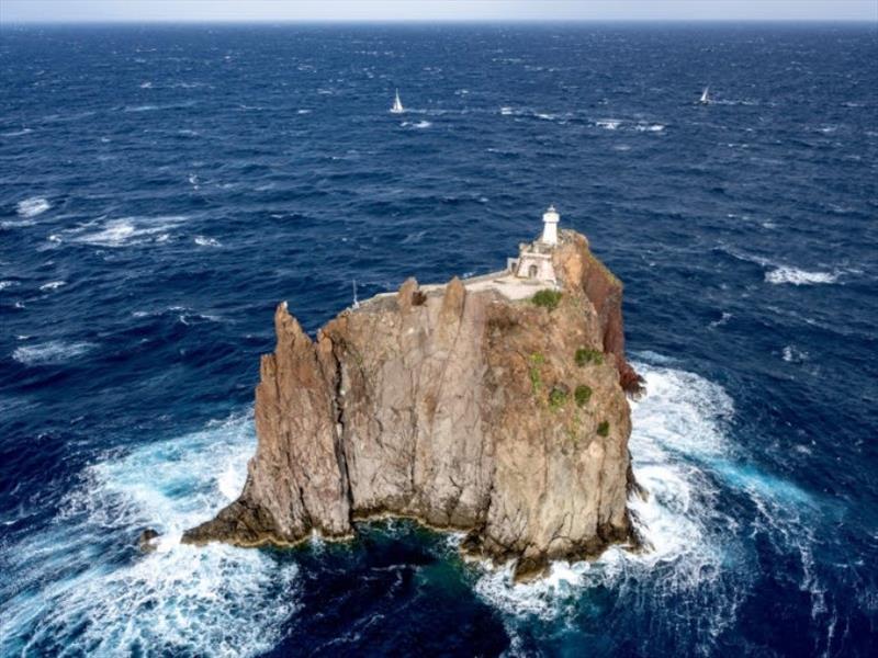 The Rolex Middle Sea Race fleet negotiate the passage close to Strombolicchio lighthouse - photo © Kurt Arrigo / Rolex