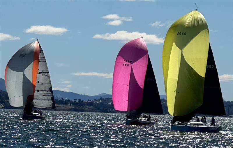 Young Magic with a pink kite comes in for a tight finish photo copyright Collette Calver taken at Royal Yacht Club of Tasmania and featuring the IRC class