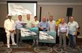Scout awarding their top worldwide dealer and top salesperson - From left to right: Nate Anderson, Alan Lang, Andy Renne, James Pate, Len Renne, Dave Wallace, Steve Potts, Bret Potts