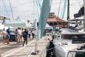 Yacht on show at VIBE 2024 with Harbor 360 Building in the background at IGY's Yacht Haven Grande St Thomas