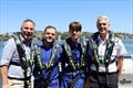 (L to R) Emergency Services Minister Jihad Dib - Marine Rescue Botany Port Hacking Unit Commander Aaron Blackwell - trainee crew Noah Blackwell - MRNSW Acting Commissioner Todd Andrews