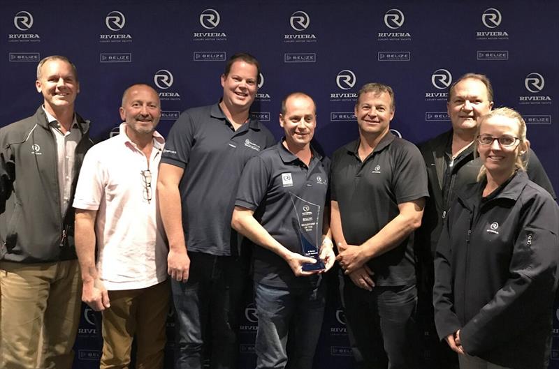 Paul Harrop, principal of R Marine South Australia (centre) accepts the award for Dealership of the Year photo copyright Riviera Australia taken at  and featuring the Marine Industry class