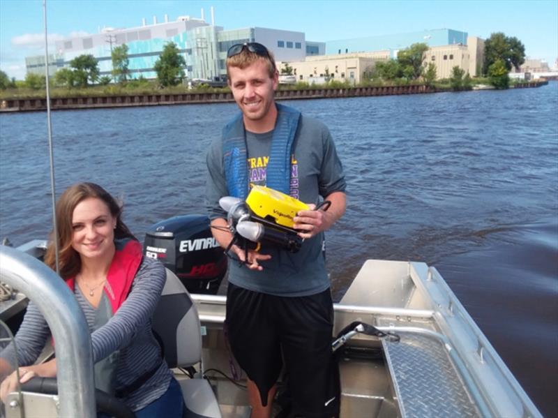 Graduate students Emily Lou LaMartina and Erik Carlson on UWM's Evinrude-powered research vessel photo copyright Rus Graham taken at  and featuring the Marine Industry class