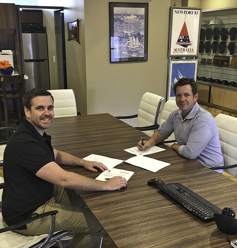 Luke Halliday (L) and Brenton Fischer (R) sign their joint venture agreement photo copyright SCM taken at  and featuring the Marine Industry class