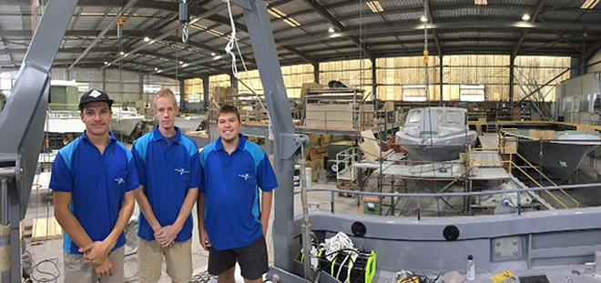 Apprentices Beau Paff, Ben Shannon and Chris Ellis in the busy fit-out bay at Steber's Taree factory complex photo copyright John Bulmer taken at  and featuring the Marine Industry class