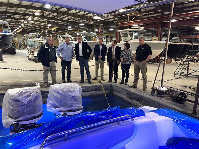 Senator Perdue (3rd from left) discusses production and testing with members of the Chaparral team photo copyright National Marine Manufacturers Association taken at  and featuring the Marine Industry class