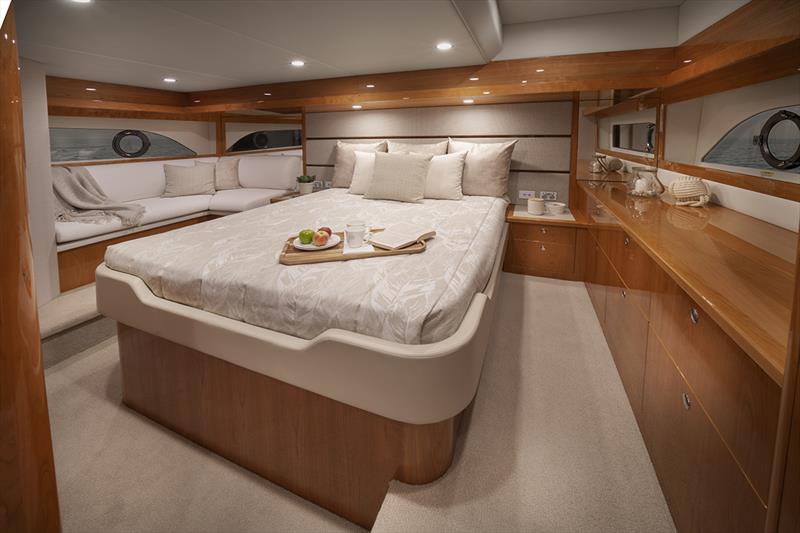 Riviera 54 Enclosed Flybridge boasts a luxurious full-beam master stateroom photo copyright Riviera Studio taken at  and featuring the Marine Industry class