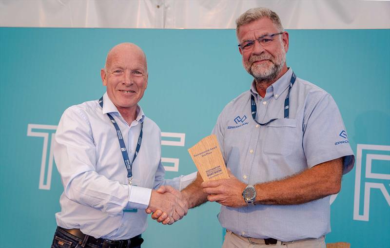 Steve Bruce (right) accepts the Exhibitor Environmental Awards runner up trophy from Mike Golding OBE photo copyright ePropulsion taken at  and featuring the Marine Industry class