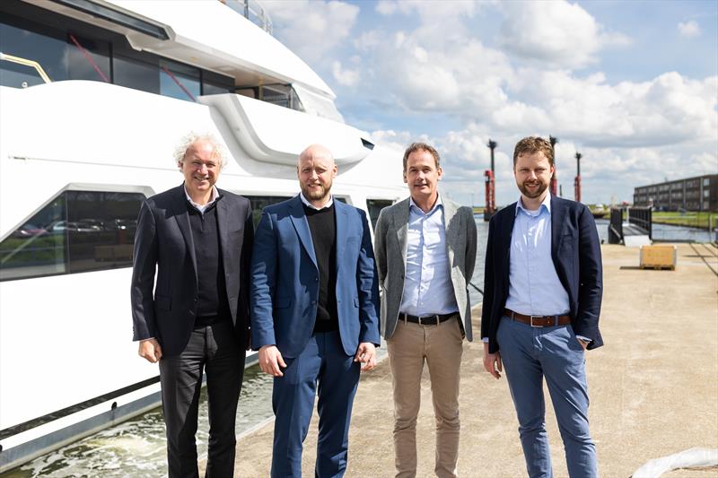 L to R at quayside of Damen Yachting in Vlissingen: Rob Luijendijk (Director Sales & Product Design, DY), Torben Sørensen (Marine Sales Director, BWT), Adriaan Roose (Amels Product Design Manager, DY), Haico van Roeden (Design & Proposal Engineer, DY) photo copyright Damen Yachting taken at  and featuring the Marine Industry class