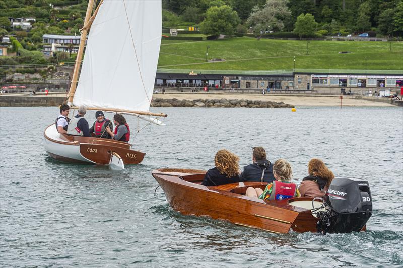 Andrew Streeter's hand built 14 ft Glued Carvel Cobby Catboat Trio is followed around Lyme harbour by Tom Thorley's magnificent outboard powered,14 ft Carvel & Cold Moulded Riva Scoiattolo photo copyright BNPS taken at  and featuring the Marine Industry class