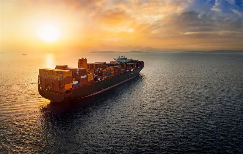 Aerial view of a large, heavy loaded container cargo ship sailing over calm sea into the sunset photo copyright Teledyne taken at  and featuring the Marine Industry class