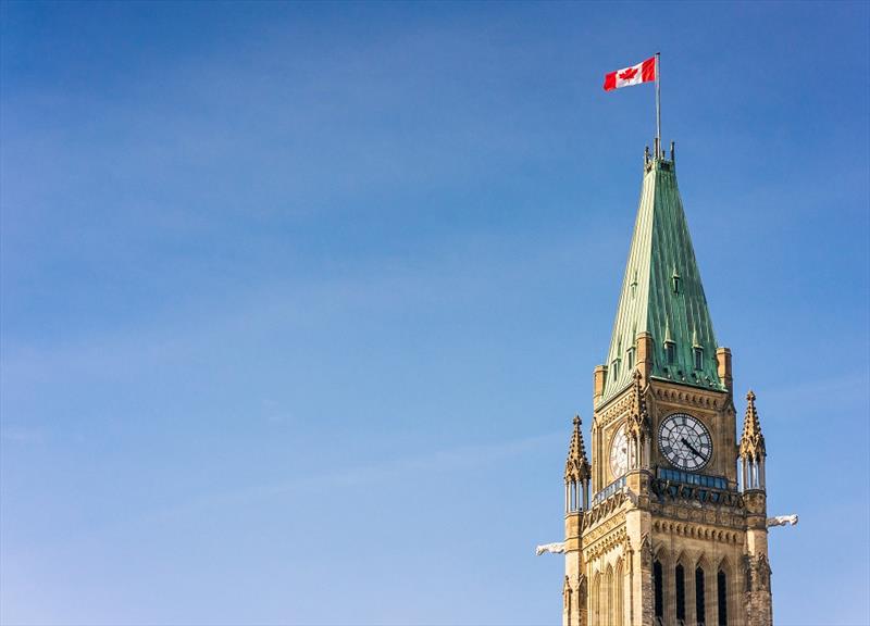 A Canadian flag flying on the top of the Peace Tower, part of the Canadian Parliament Building in Ottawa photo copyright George Clerk taken at  and featuring the Marine Industry class