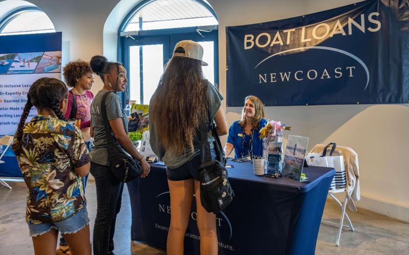 Kim Madigan, from Newcoast Financial Services, speaks to attendees about yacht financing - photo © MediaBoostVI