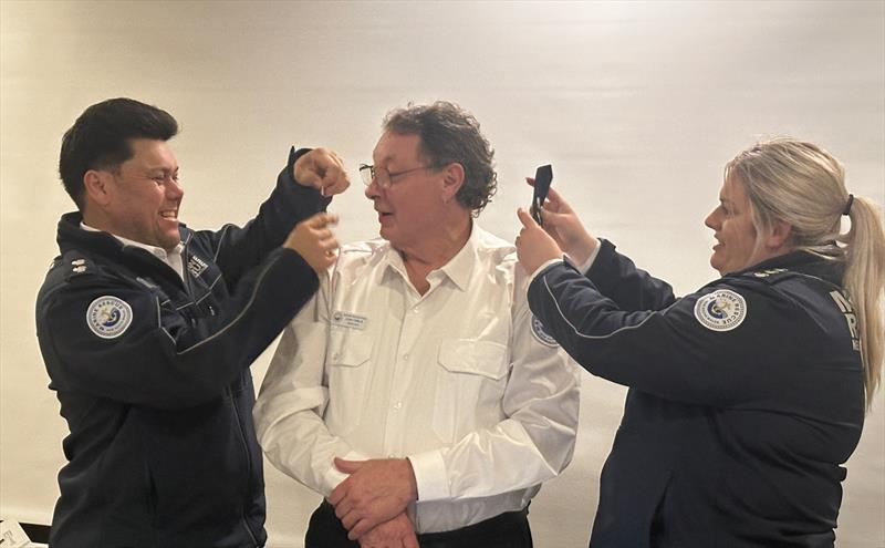 Brad Clarke and Stefania Ring present new Deputy Unit Commander John Tomlin (centre) with his epaulettes photo copyright Marine Rescue NSW taken at  and featuring the Marine Industry class